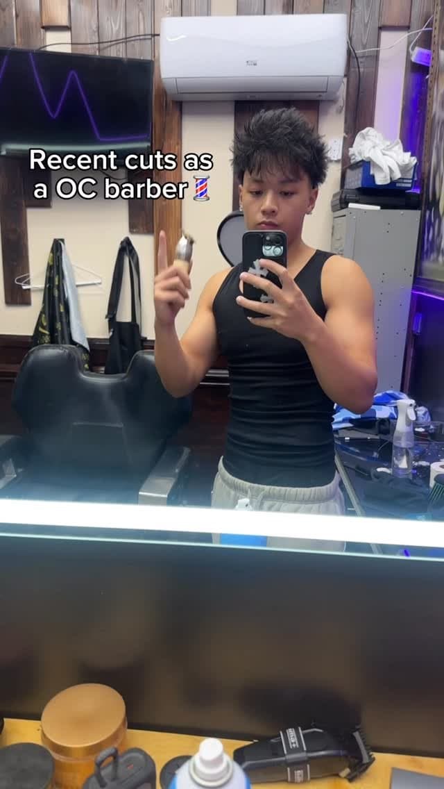 The barber in the studio, clippers in hand